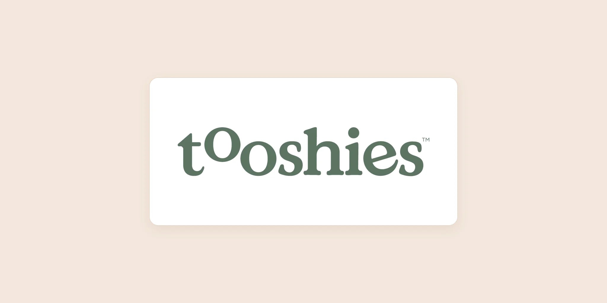 Tooshies logo centered on a light warm background